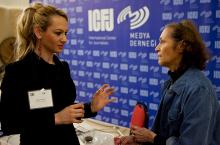 Trainer Sherry Ricchiardi engages participant Dilek Yılmaz of Bengü Türk TV. Copyright 2011 Frank S. Folwell.